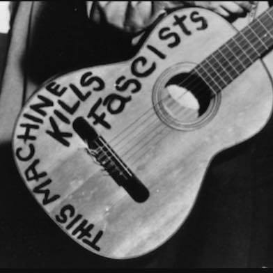 A cropped image of Woody Guthrie's guitar. Shared by a friend on facebook with the call to all artists to take a stand. 